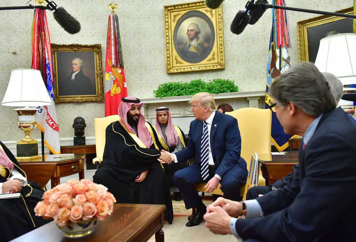 President Donald Trump shakes hands with Saudi Crown Prince Mohammed bin Salman of the Kingdom of Saudi Arabia at the White House while Secretary of Energy Rick Perry looks on, March 20, 2019 (Photo: Kevin Dietsch-Pool/Getty Images)