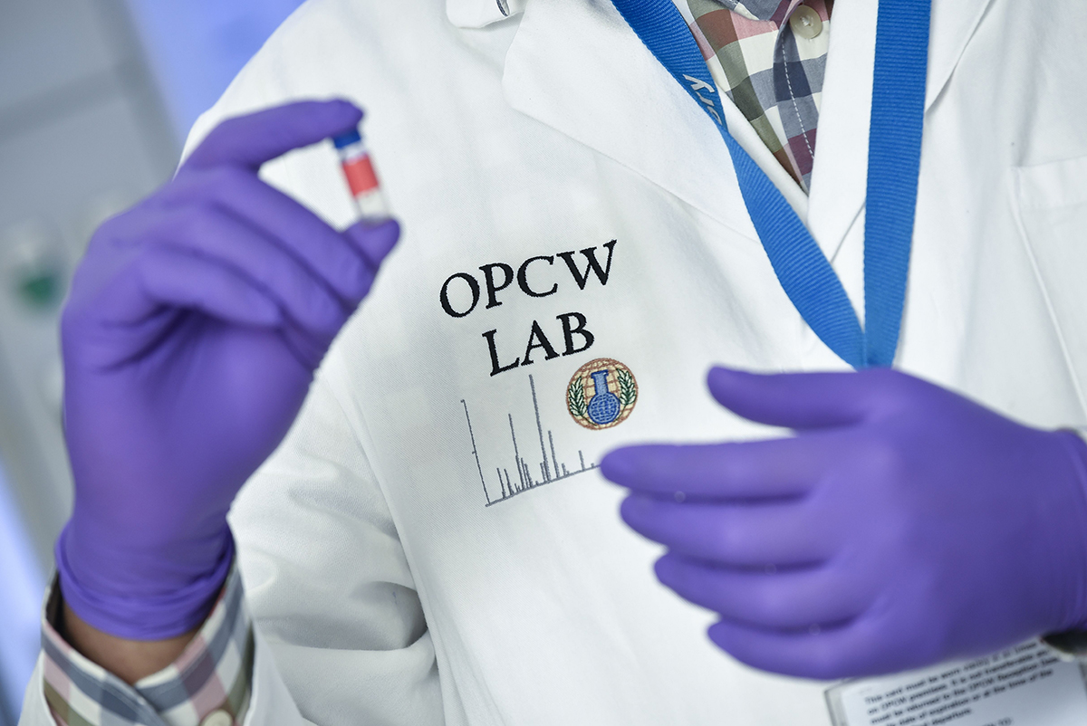 A laboratory technician controls a test vial at the OPCW headquarters. The organization has been key to the two decades of painstaking work to eliminate the world's toxic arms stockpiles. (Photo: John Thys/AFP via Getty Images)