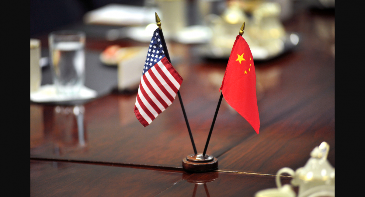The American and Chinese flags stand at center table before U.S. Deputy Defense Secretary Ashton B. Carter welcomes Cai Yingting, Chinese deputy chief of the General Staff of the People's Liberation Army, to a meeting at the Pentagon, Aug. 23, 2012. (Photo: U.S. Dept. of Defense)