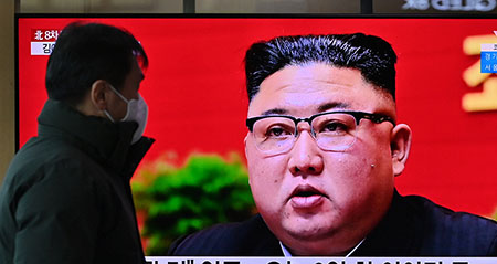 A man watches a television screen showing news footage of North Korean leader Kim Jong Un attending the 8th congress of the ruling Workers' Party held in Pyongyang, at a railway station in Seoul on January 6, 2021. (Photo by Jung Yeon-je / AFP via Getty Images)