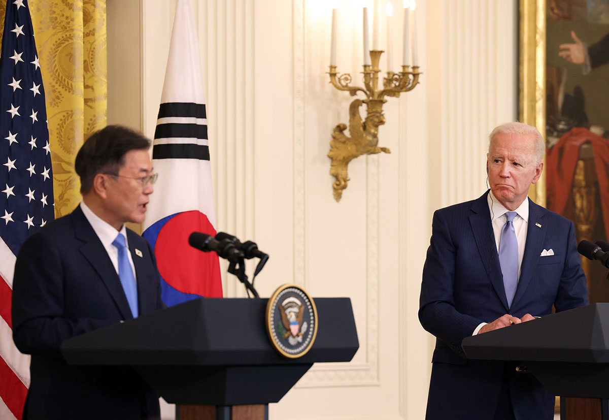 U.S. President Joe Biden (R) and South Korean President Moon Jae-in participate in a joint press conference in the East Room of the White House on May 21, 2021 in Washington, DC. Moon Jae-in is the second world leader to be hosted by President Biden at the White House. (Photo by Anna Moneymaker/Getty Images)