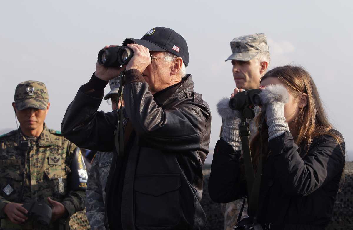 U.S. Vice President Joe Biden and his granddaughter Finnegan Biden look through binoculars toward North Korea during a visit to observation post Ouellette at the Demilitarized Zone (DMZ) on December 7, 2013 in Panmunjom, South Korea. (Photo by Chung Sung-Jun/Getty Images)