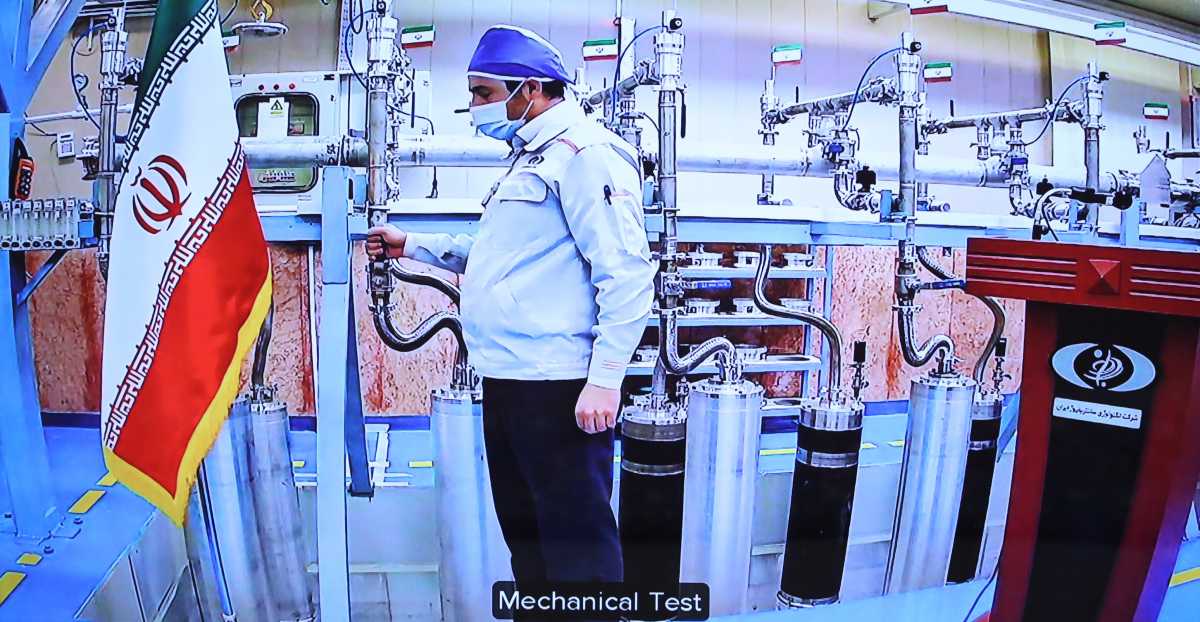 An engineer performs a mechanical test on nuclear equipment as President of Iran, Hassan Rouhani attends opening ceremony of nuclear projects in different regions of the country via video conference on 11th anniversary of National Nuclear Technology Day in Tehran, Iran on April 10, 2021. Rouhani instructed that the new generation centrifuges at the Natanz Nuclear Facilities in Isfahan to start operation. (Photo by Iranian Presidency/Handout/Anadolu Agency via Getty Images)