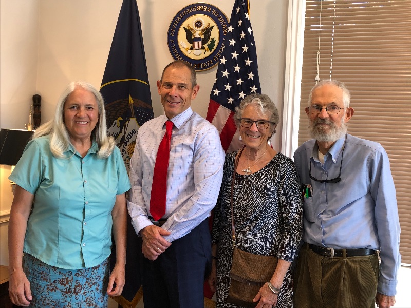 Utah residents, Deb Sawyer (left), Catherine Kreuter, and Doug Stark (right), meet with Representative John Curtis (R-Ut.),