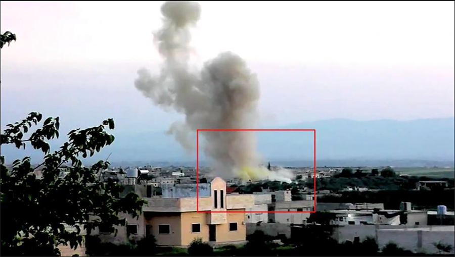 Screenshot from a video posted to YouTube on April 11, 2014 shows substantial yellow coloration at the base of the cloud over Kafr Zita, Syria, drifting with main cloud. Chlorine is suspected to have been used in that attack. (Via Human Rights Watch)