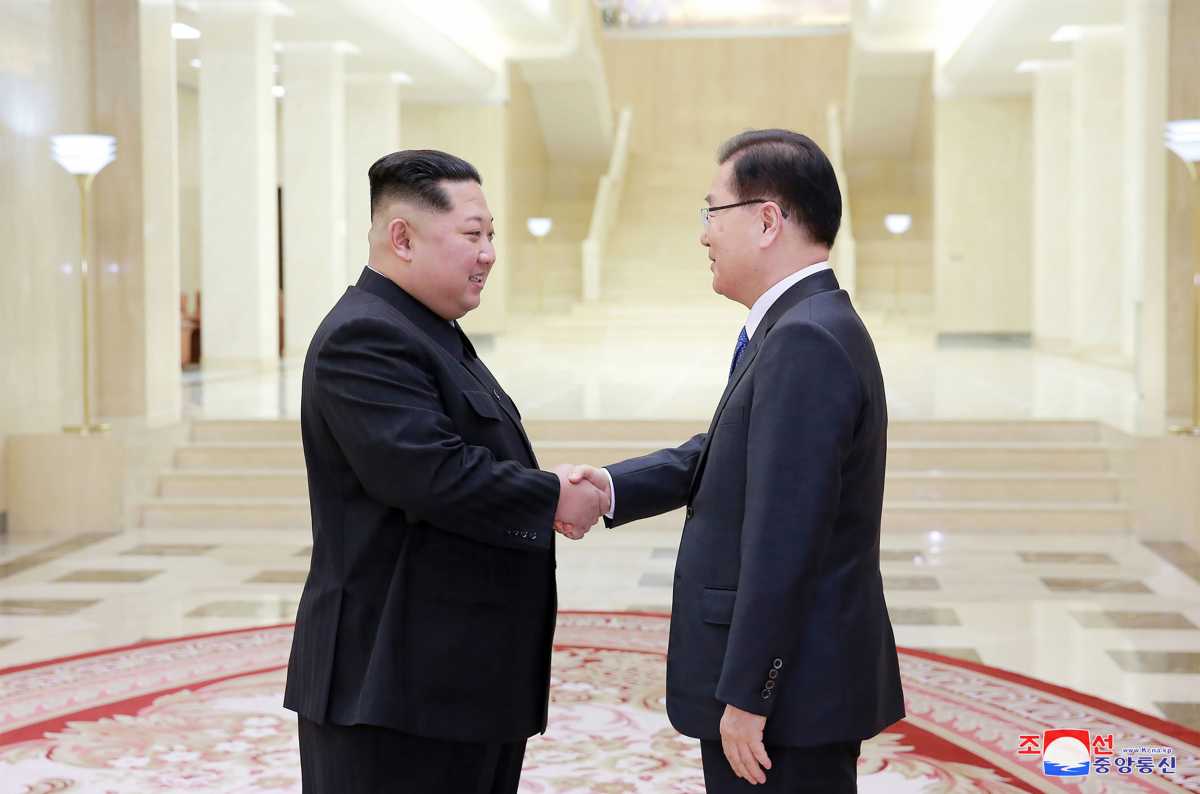 North Korean leader Kim Jong-Un (L) shaking hands with South Korean chief delegator Chung Eui-yong (R), who travelled as envoys of the South's President Moon Jae-in, during their meeting in Pyongyang. (Photo: STR/AFP/Getty Images)