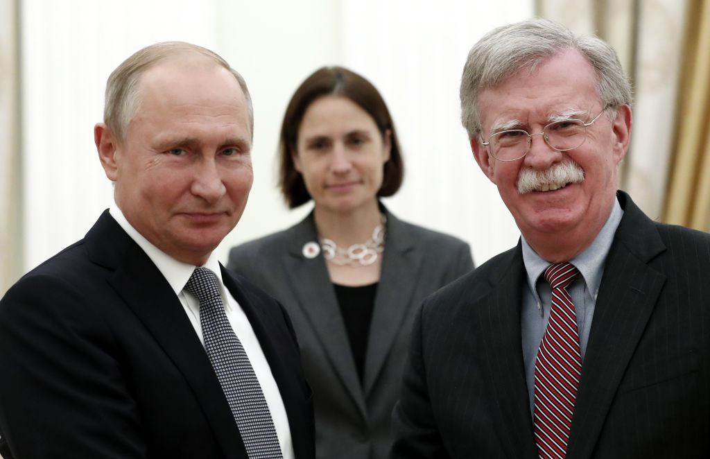 Russian President Vladimir Putin shakes hands with John Bolton, National Security Adviser to the US President, during a meeting at the Kremlin in Moscow on October 23, 2018. (Photo credit: Maxim Shipenkov/AFP/Getty Images)