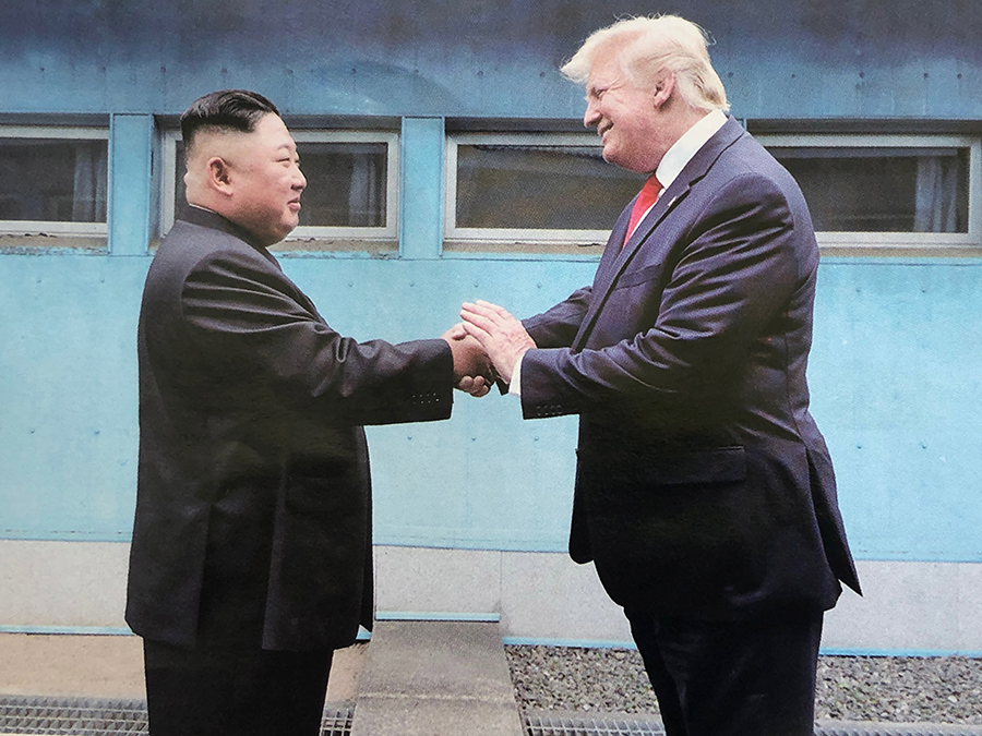 North Korean leader Kim Jong Un (L) and U.S. President Donald Trump inside the demilitarized zone separating South and North Korea on June 30, 2019 during their third meeting. Their hopes of revitalizing stalled nuclear talks failed. North Korea now is forging closer relations with China and Russia. (Photo by API/Gamma-Rapho via Getty Images)