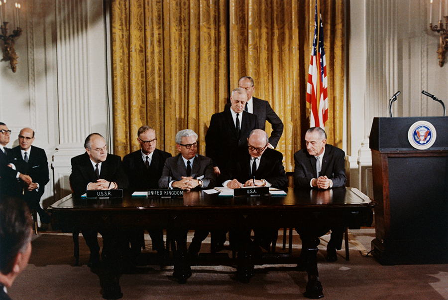 President Lyndon B. Johnson (R) watches the signing of Outer Space Treaty, which bans weapons in outer space, on January 27, 1967. (Photo by © CORBIS/Corbis via Getty Images)