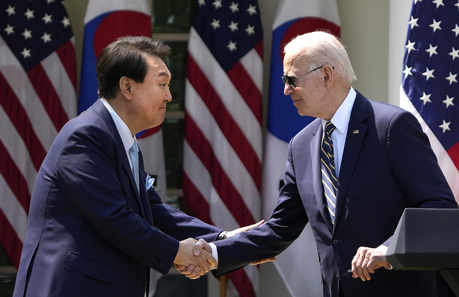 U.S. President Joe Biden (R) and South Korean President Yoon Suk Yeol shake hands during a joint press conference at the White House in April 2023. The Washington Declaration they agreed upon is designed in part to deepen bilateral coordination to ensure Seoul does not escalate crises with Pyongyang. (Photo by Drew Angerer/Getty Images)