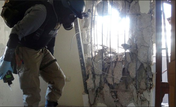 A UN inspector at one of the sites of the Aug. 21, 2013 chemical weapons attack in the Damascus suburbs.